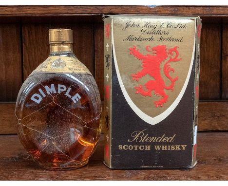 A boxed bottle of Dimple Scotch Whisky