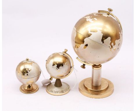 A three piece matched German Retro globe desk set to include: cigarette dispenser, table lighter and desk clock (3)&nbsp;