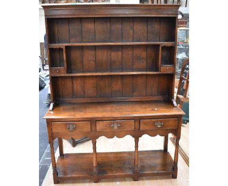 A late 20th Century Olde Charm style kitchen dresser with two shelf plate rack, small proportions