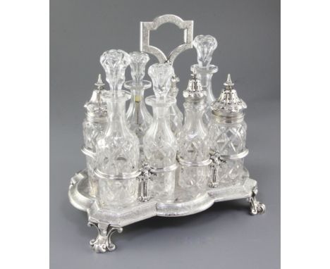 A Victorian silver eight bottle cruet stand and eight original bottles, by Walter & John Barnard, hallmarked London 1878/ 187