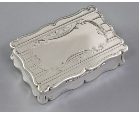 A Victorian silver snuff box, by Edward Smith, hallmarked Birmingham 1857, of rectangular form with shaped scalloped sides an