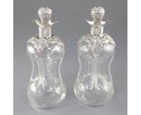 A pair of Edwardian silver mounted waisted glass decanter and stoppers, by Alexander Clark Manufacturing Co, Birmingham, 1909