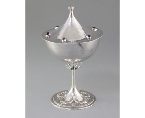 A good Edwardian Arts & Crafts gem set planished silver cup and cover, by Guild of Handicrafts Ltd, possibly from a design by