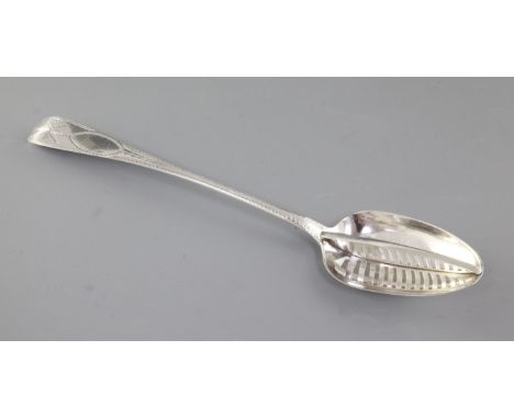 A large George IV Irish silver strainer spoon, by Samuel Neville, hallmarked Dublin 1822, with bright cut and star decoration