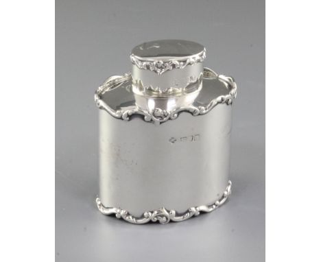 An Edwardian silver tea caddy and cover, by Horace Woodward & Co Ltd, hallmarked London, 1902, of oval form with cast and app