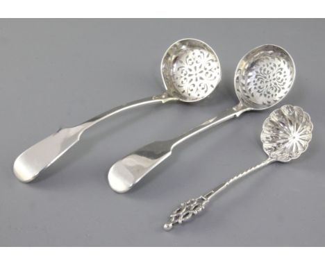An early Victorian silver fiddle pattern sifter spoon, by John Harris IV, hallmarked London 1841 and two other silver sifter 