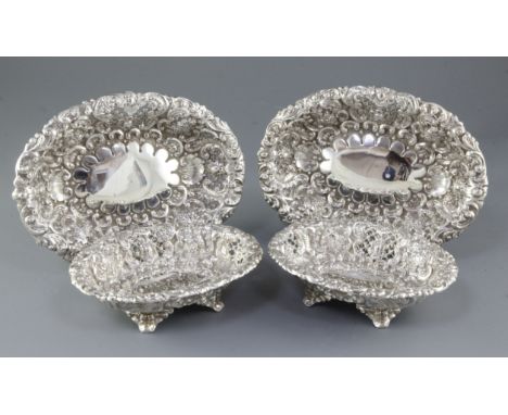 A matched set of four Victorian embossed silver dishes (two pairs), by Horace Woodward & Co/ Ltd, hallmarked for London 1892/