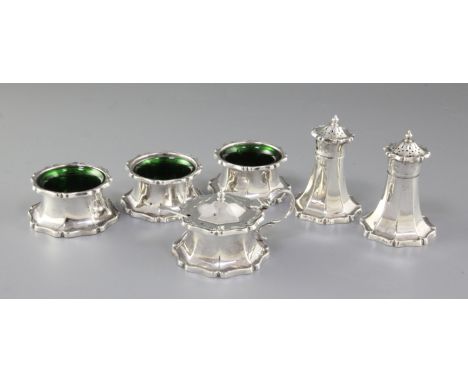 An Art Nouveau George V silver six piece cruet set, hallmarked Sheffield 1911, makers Joseph Rodgers & Sons, comprising three