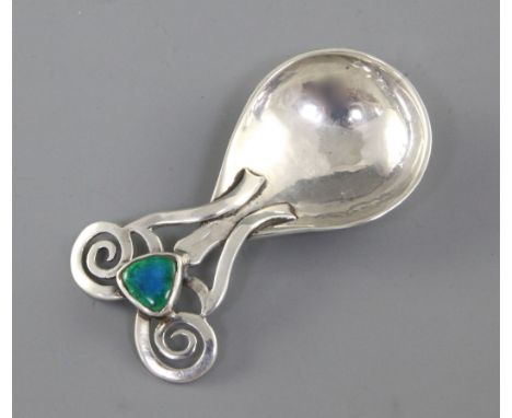 A good Edwardian Arts & Crafts planished silver and enamel caddy spoon, by Omar Ramsden & Alwyn Carr, hallmarked for London 1