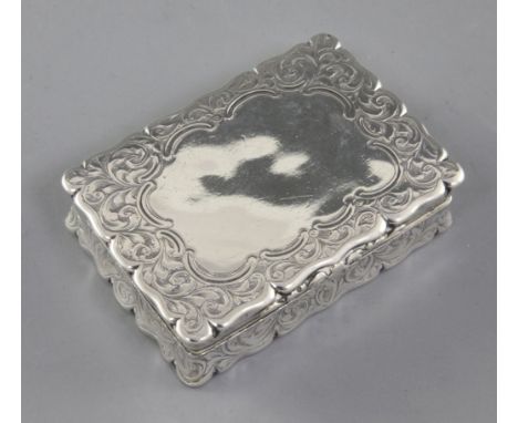 A Victorian silver snuff box, by Edward Smith, hallmarked Birmingham 1860, of shaped rectangular form, with engraved scroll a