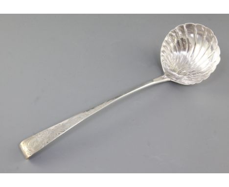 A George III Irish silver soup ladle, by Michael Keating, hallmarked Dublin 1773, with a hook end and engraved flaming cauldr