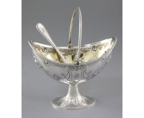 A Victorian silver swing handled sugar basket and sifter spoon, by Martin, Hall & Co, basket hallmarked for London 1877, the 