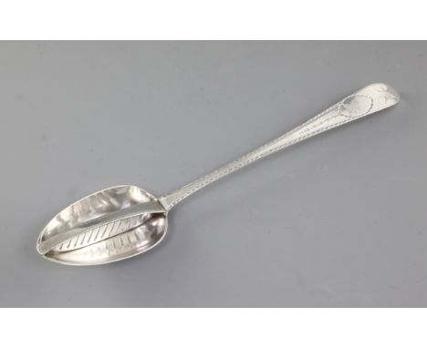 A George III Irish silver strainer spoon, by John Osborne, hallmarked Dublin 1791, with bright cut engraved and star decorati