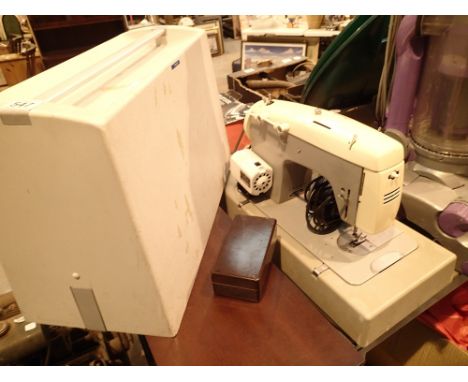Cased Cresta sewing machine  CONDITION REPORT: All electrical items in this lot have been PAT tested for safety and have pass