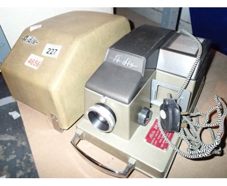 Aldis slide projector in case  CONDITION REPORT: All electrical items in this lot have been PAT tested for safety and have pa