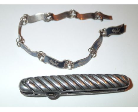 Hallmarked silver folding button hook (marks rubbed) and a Siam silver bracelet 