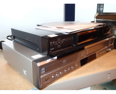 JVC cassette/DVD player and a Humax HDMI PVR 9300T recorders with manuals remotes in office 4553 CONDITION REPORT: All electr