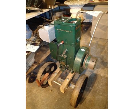 Lister D type engine 5 HP 700 rpm dated 5 August 1933 serial number 7770 DH3 on a two wheeled trolley. This engine was introd