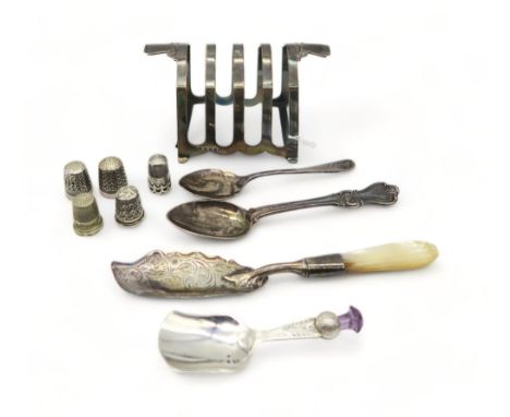 A silver four division toast rack, by William Adam, Birmingham 1935, a silver caddy spoon, by&nbsp;W Johnson &amp; Son Ltd, B