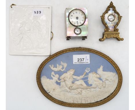 A German miniature mother of pearl mounted alarm clock, a French gilt metal and enamel miniature clock, a lithophane panel an