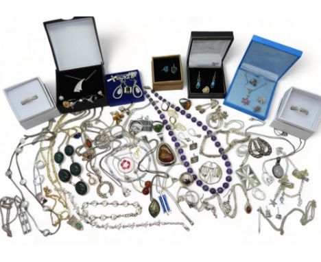 A collection of silver and white metal items to include two Ortak silver and enamel pendants, a moon stone pendant , amethyst