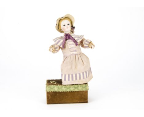 A Reuge child doll automaton, With bisque head, blue glass eyes, blonde wigs, head turning and arm lifting mechanism, dressed