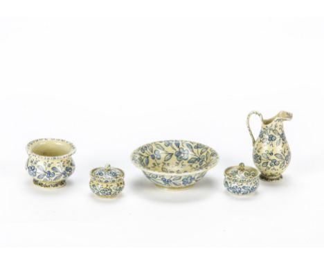 A German dolls’ house turned and painted wooden wash set, Cream painted ground with blue leaves, flowers and berries, compris