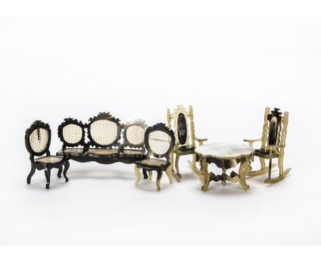 Unusual horn dolls’ house furniture, A three-seater sofa —4½in. (11.5cm.) wide and two matching chairs with pierced seats and