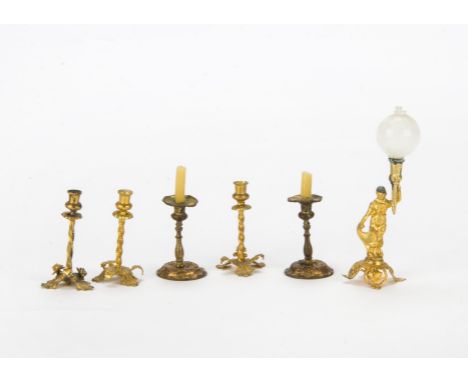 German gilt metal dolls’ house lighting, A figure of a lady holding an oil-lamp —3½in. (9cm.) high (shade damaged at base); t