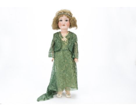 An Armand Marseille 390 child doll, With lashed blue sleeping eyes, light brown bobbed mohair wig, jointed composition body, 