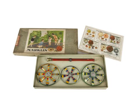 A Märklin 9086 Flying Tops set, Three lithographed tinplate multicoloured propellor blade tops, driving stick, catalogue, in 