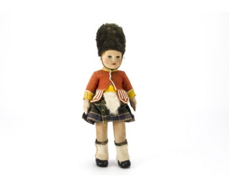 A Chad Valley Highlander doll,  With pressed felt face, blue glass eyes, brown mohair wig, jointed cloth body, felt and wool 