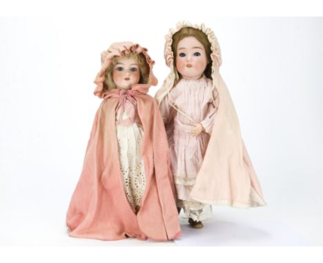 Two German bisque-headed dolls, A doll marked 53, possibly Recknagel with blue sleeping eyes, brown mohair wig, jointed compo