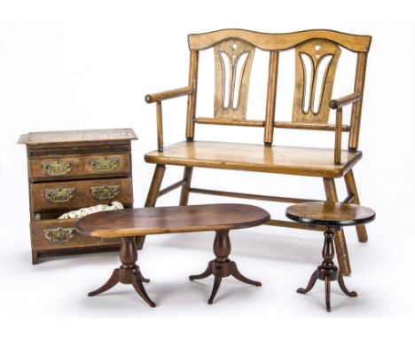 Doll’s furniture, A varnished wood two seater chair —16½in. (42cm.) high; an oak chest of drawers with brass handles with hea
