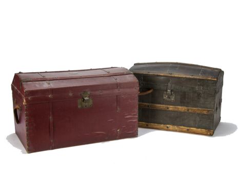 Two dolls’ trunks, One red oil-cloth with brass studs, three lift-out trays —18¼in. (46.5cm.) wide (some damage); and an Amer