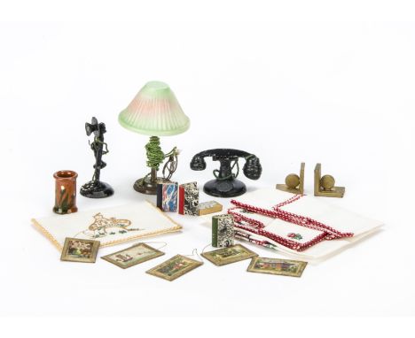 Dolls’ house chattels, five miniature watercolours in gold painted frames, an electric tinplate lamp with celluloid share, ca
