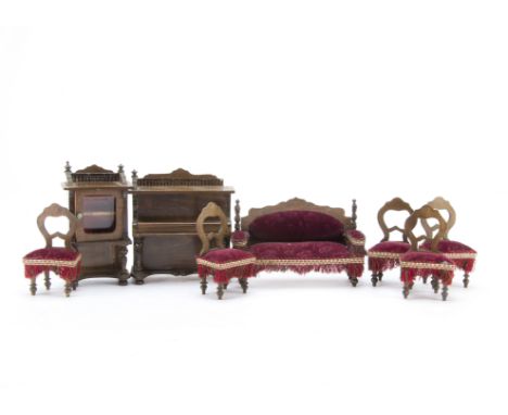 A German dolls’ house drawing room set circa 1910,  A sofa upholstered in figured Burgundy velvet —5½in. (14cm.) wide, five m