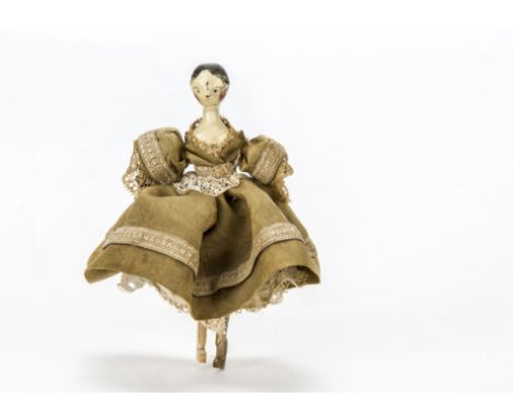 A Grodnerthal dolls’ house doll, Carved and painted wood with black painted hair, jointed body and redressed in light brown s