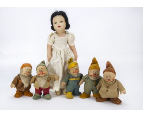 A Chad Valley Snow White and five Dwarves,  with original dress and black mohair wig —16½in. (42cm.) high; and dwarves includ