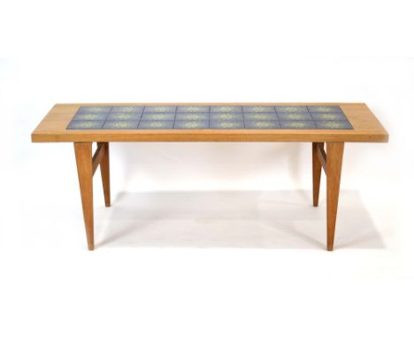 A 1960's Danish oak and tile set coffee table on tapered legs, w. 150 cm CONDITION REPORT: Typical wear