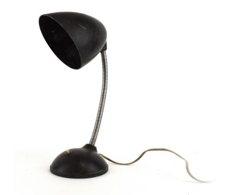 A Bauhaus-era desk lamp with a bakelite shade and flexible shaft CONDITION REPORT: Working order unknown. Lead cut. Crack to 