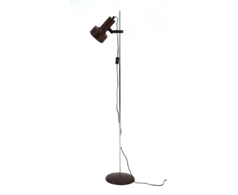 A 1970's single-spot standard lamp with a brown enamelled shade CONDITION REPORT: Working order unknown. Lead cut. Wear and m