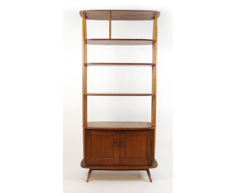An Ercol elm and beech room divider, h. 191 cm CONDITION REPORT: H. 191cm W. 90cm D.40cm. Marks to surface and typical genera