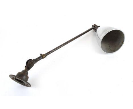 A 1930/40's Dugdills of Stockport wall-mounted single-arm lamp with a polished shade