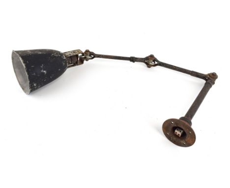 A 1940/50's Dugdills of Stockport industrial wall-mounted three-arm machinist's lamp with a black plastic shade  CONDITION RE