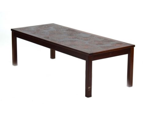 A stained teak tile topped coffee table on square legs, w. 130 cm CONDITION REPORT: Typical wear and surface scratches 