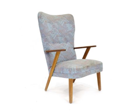 A 1970's and later button upholstered highback armchair with a teak frame*Sold subject to our soft furnishings policy https:/