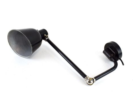 Attributed to Kandem, a German Bauhaus black enamelled adjustable wall-clamped lamp, marked '2581' 
