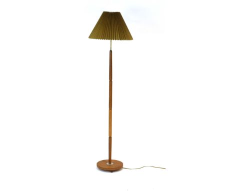 A 1960's turned oak and brass standard lamp with pleated gold shade CONDITION REPORT: Working order unknown. Lead cut. Shade 