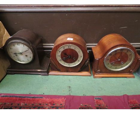 Two walnut mantel clocks and an oak example 